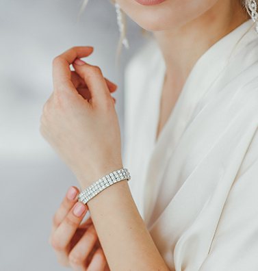 A woman wearing an ALBI diamond bracelet